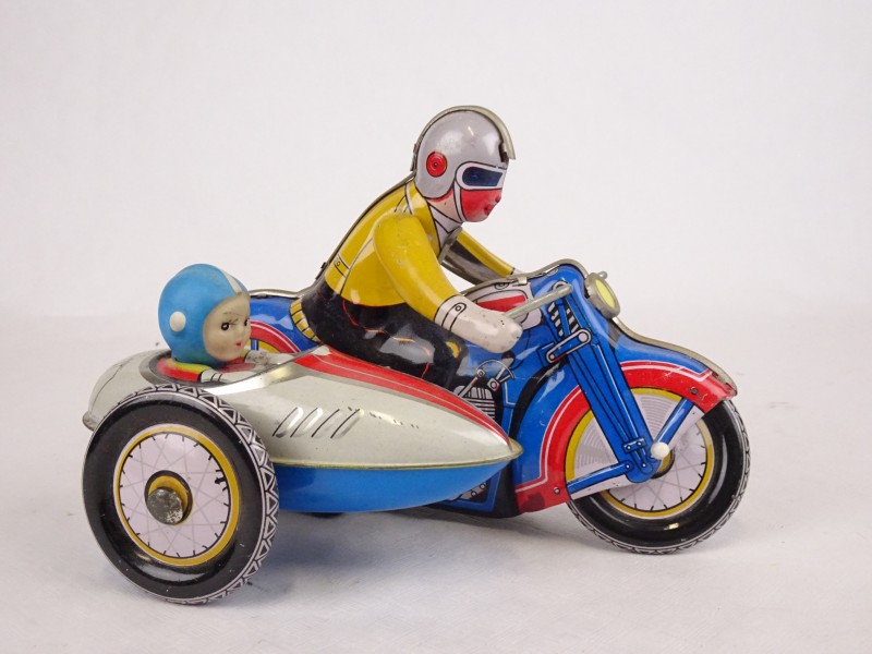 Vintage toy uit blik: Motorijder met seidecar.
