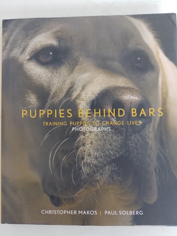 Puppies behind bars - training puppies to change lives - Christopher Makos/Paul Solberg.