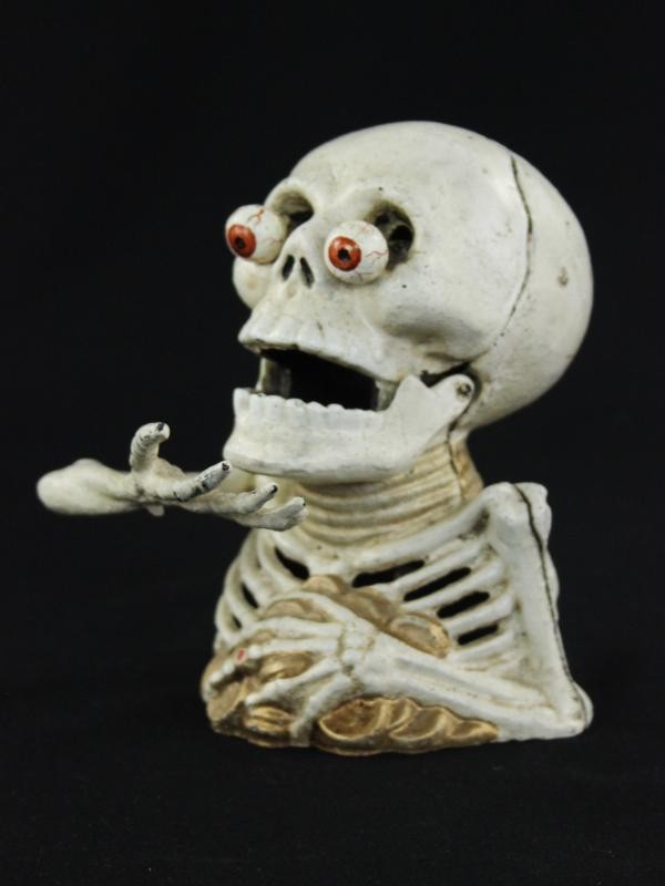 Gietijzeren skelet spaarpot - Griezel met een missie
